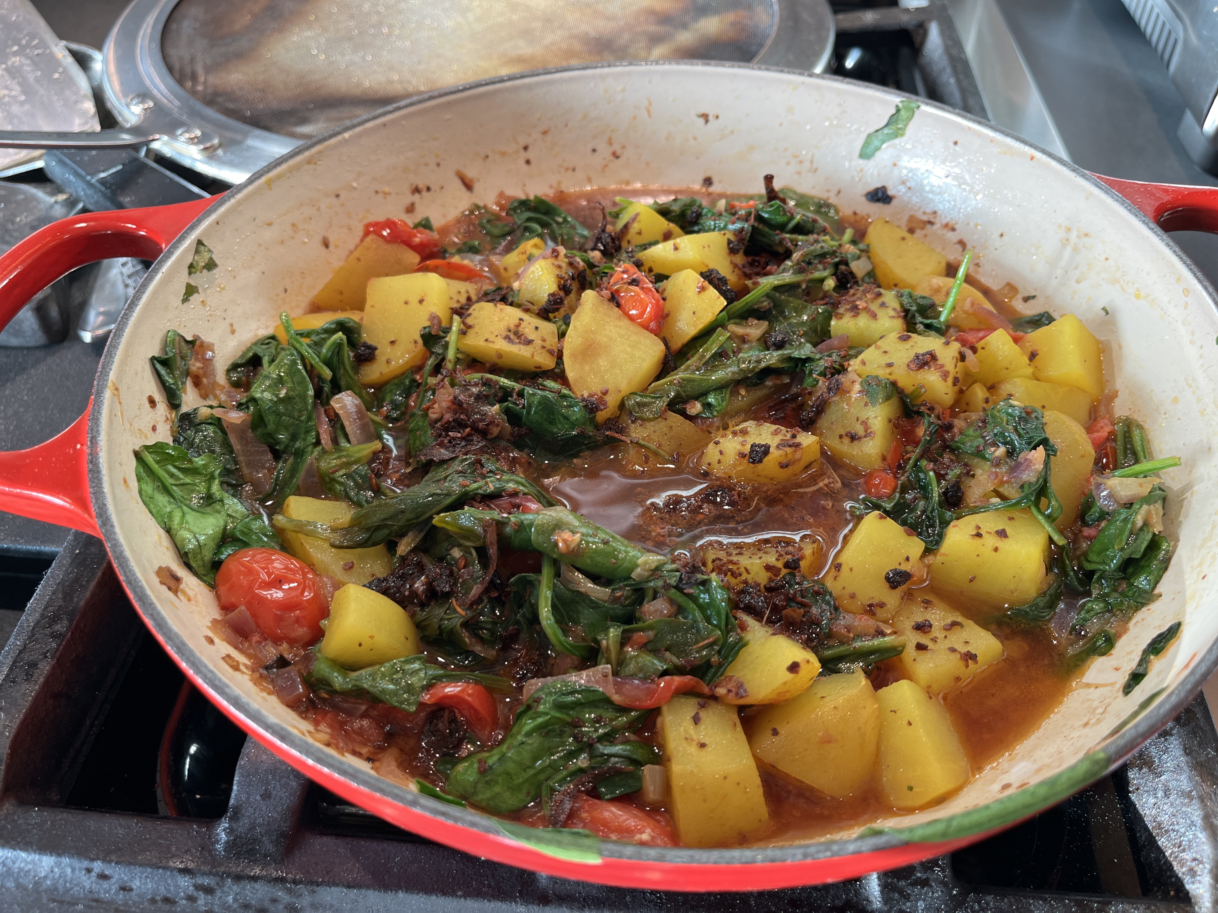 Image of Gently toss the potatoes with the spinach mixture. 