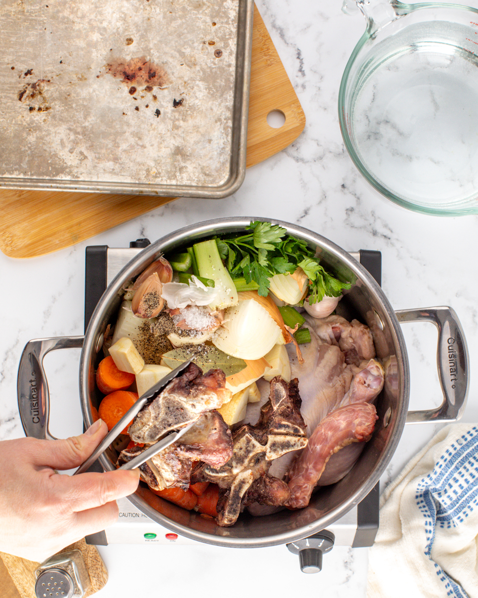Image of Preheat the oven to 450F. Place beef bones onto a...