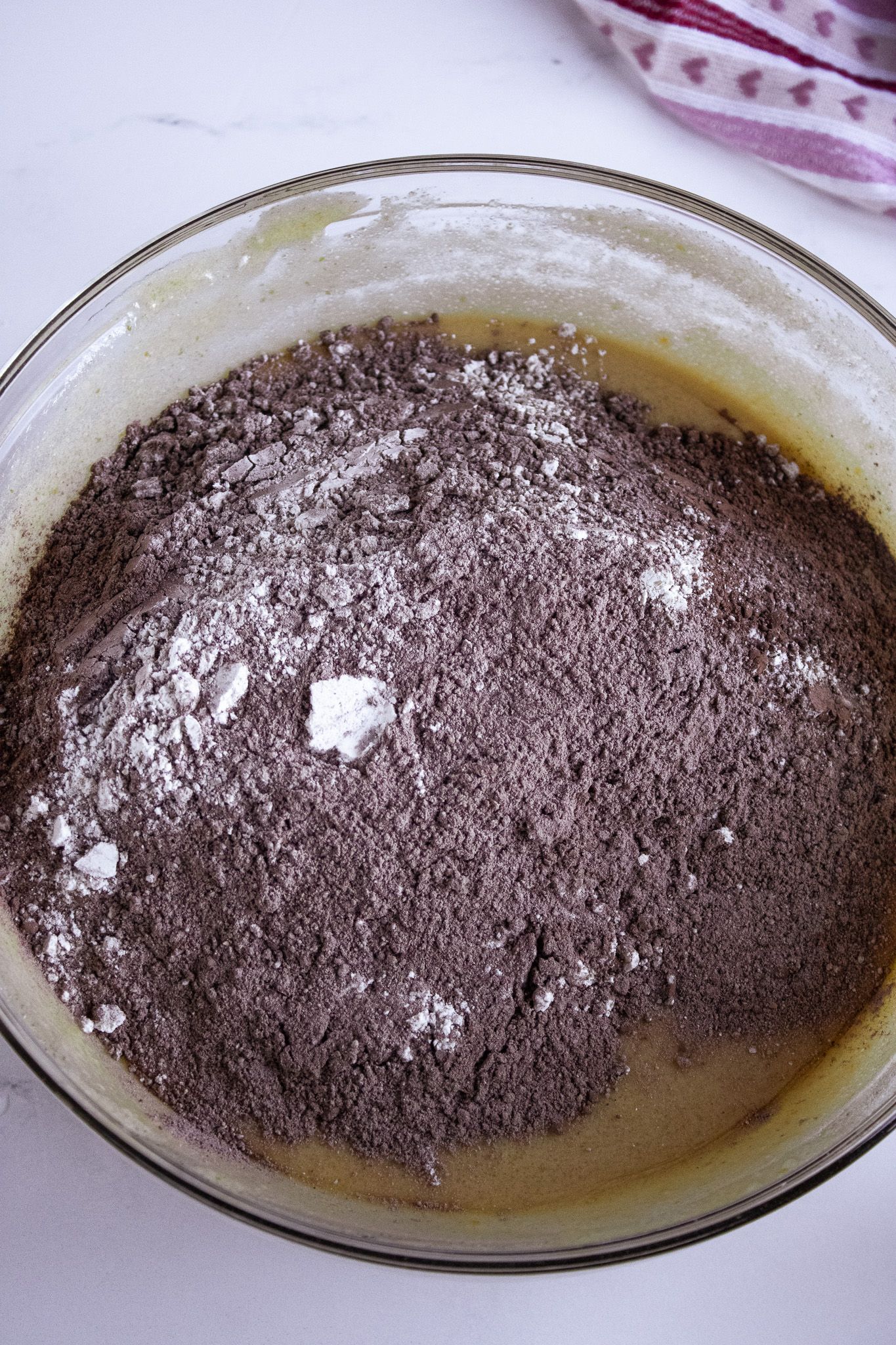 Image of Mix together flours, cocoa in a bowl