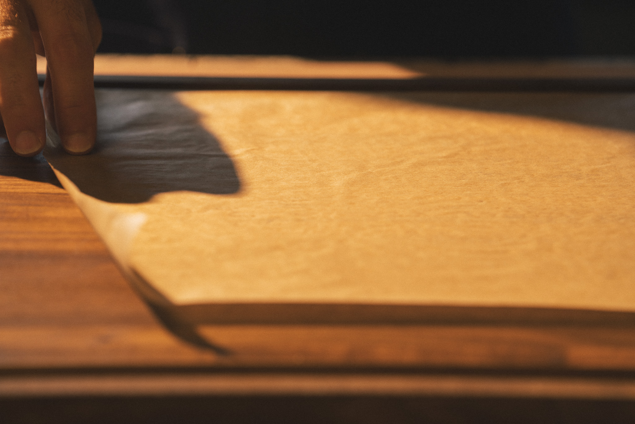 Image of Prepare the parchment:Cut two large squares of parchment paper, each...