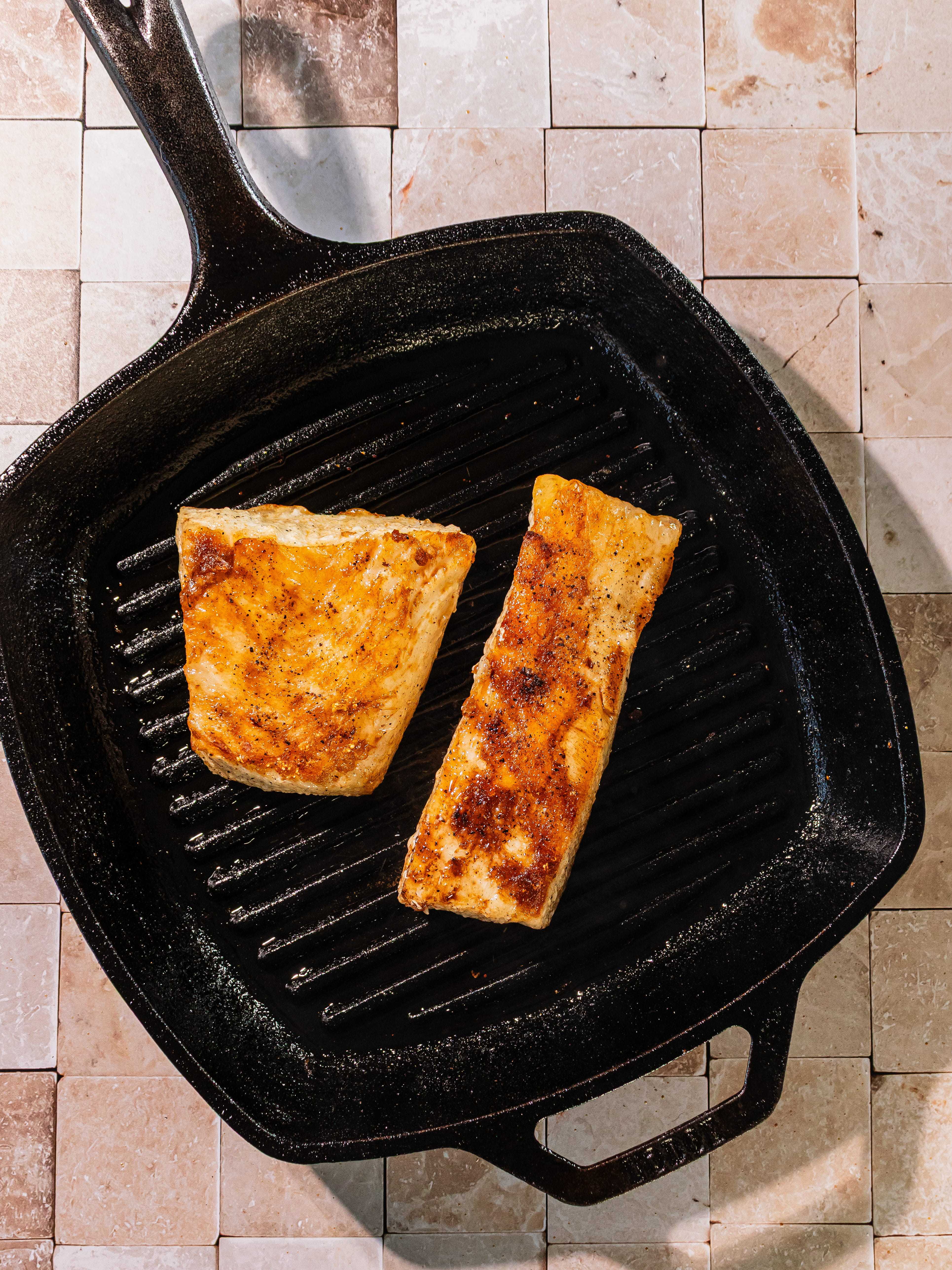 Image of Serve hot with herb caper sauce spooned on top.