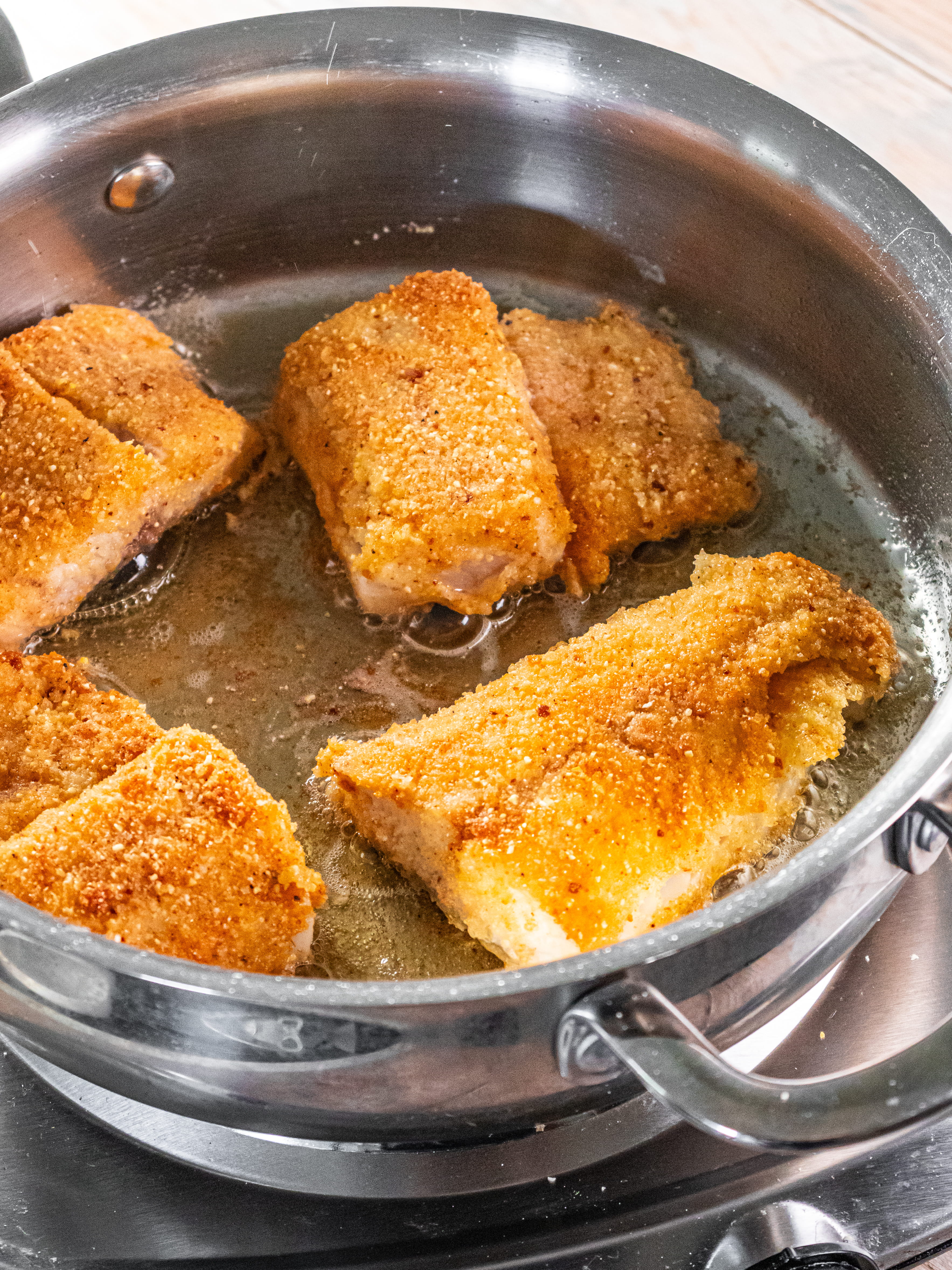 Image of Heat tallow in a large skillet over medium heat (start...