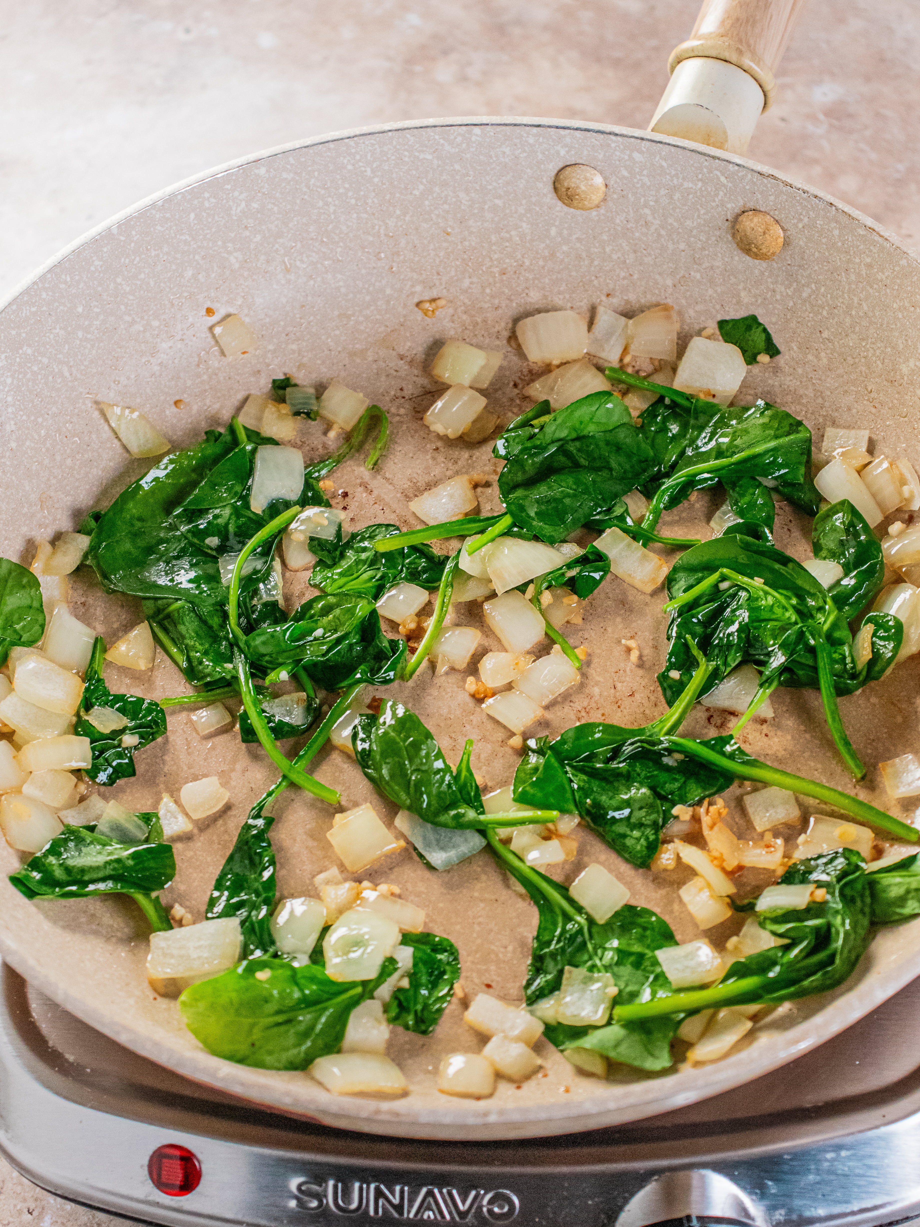 Image of Add onion and garlic to skillet. Sauté for 5 minutes....