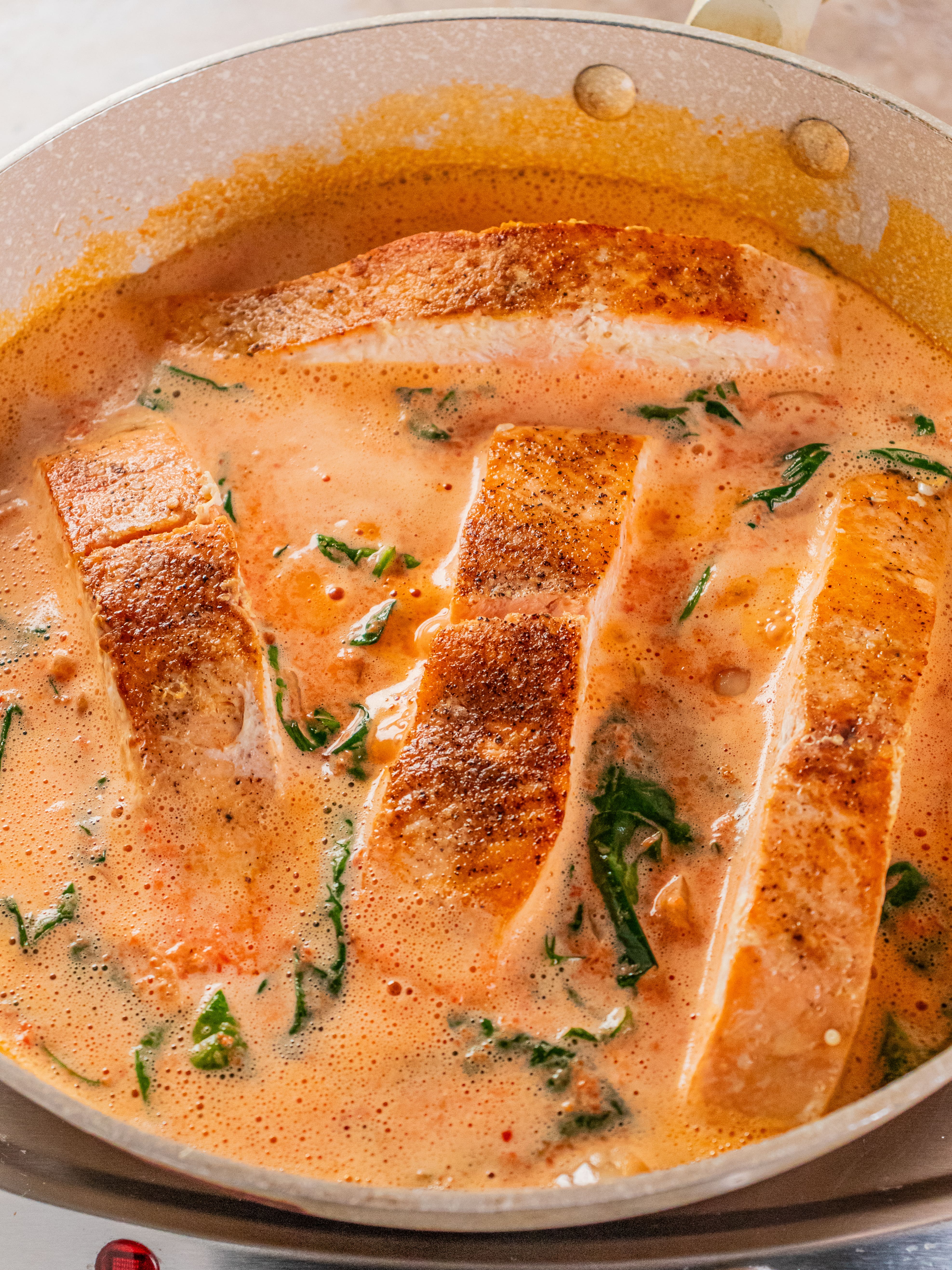 Image of Reduce heat to medium-low and stir in sauce. Return salmon...
