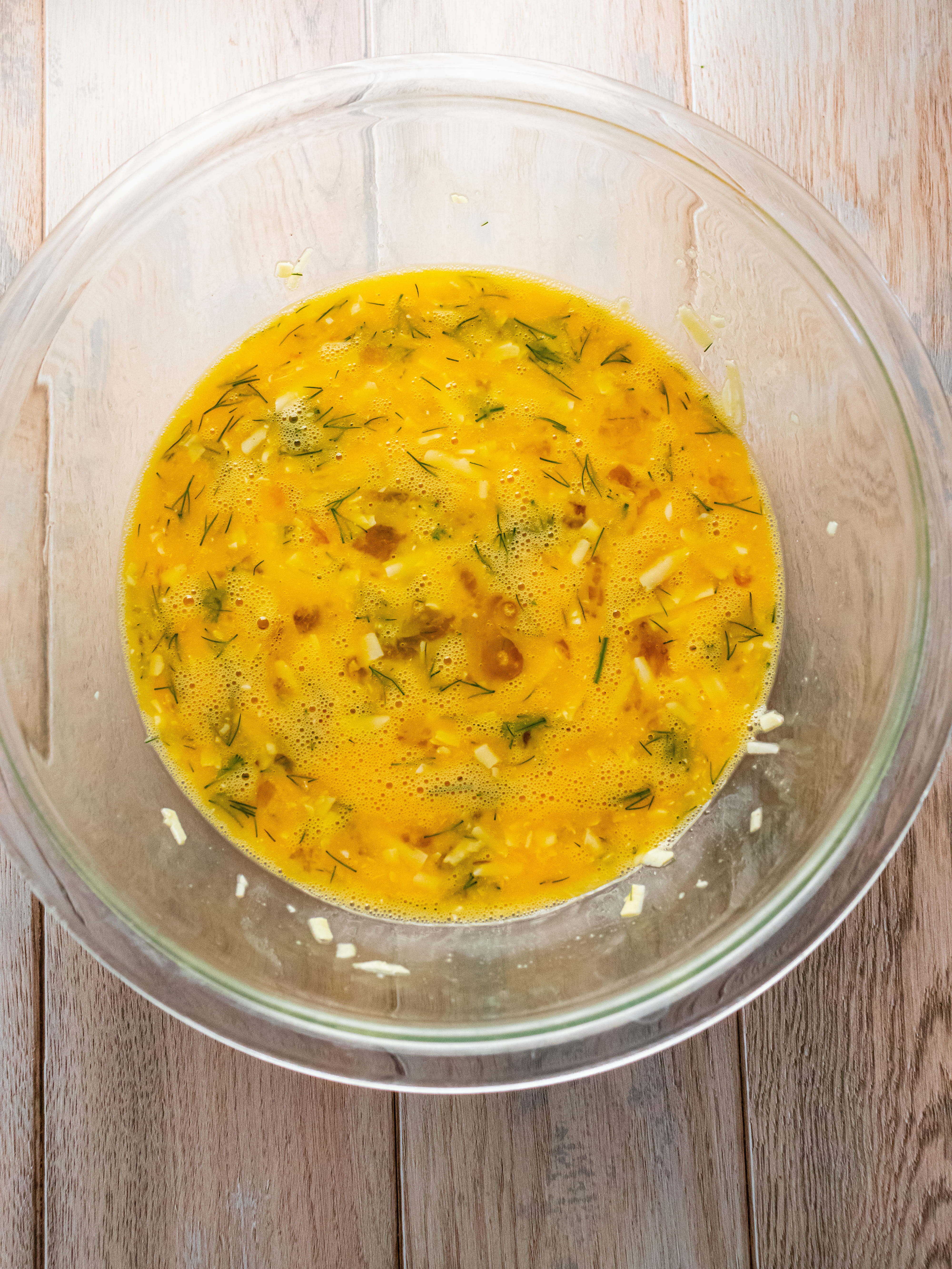 Image of While leeks cook, whisk together eggs, gruyere cheese, dill, salt,...