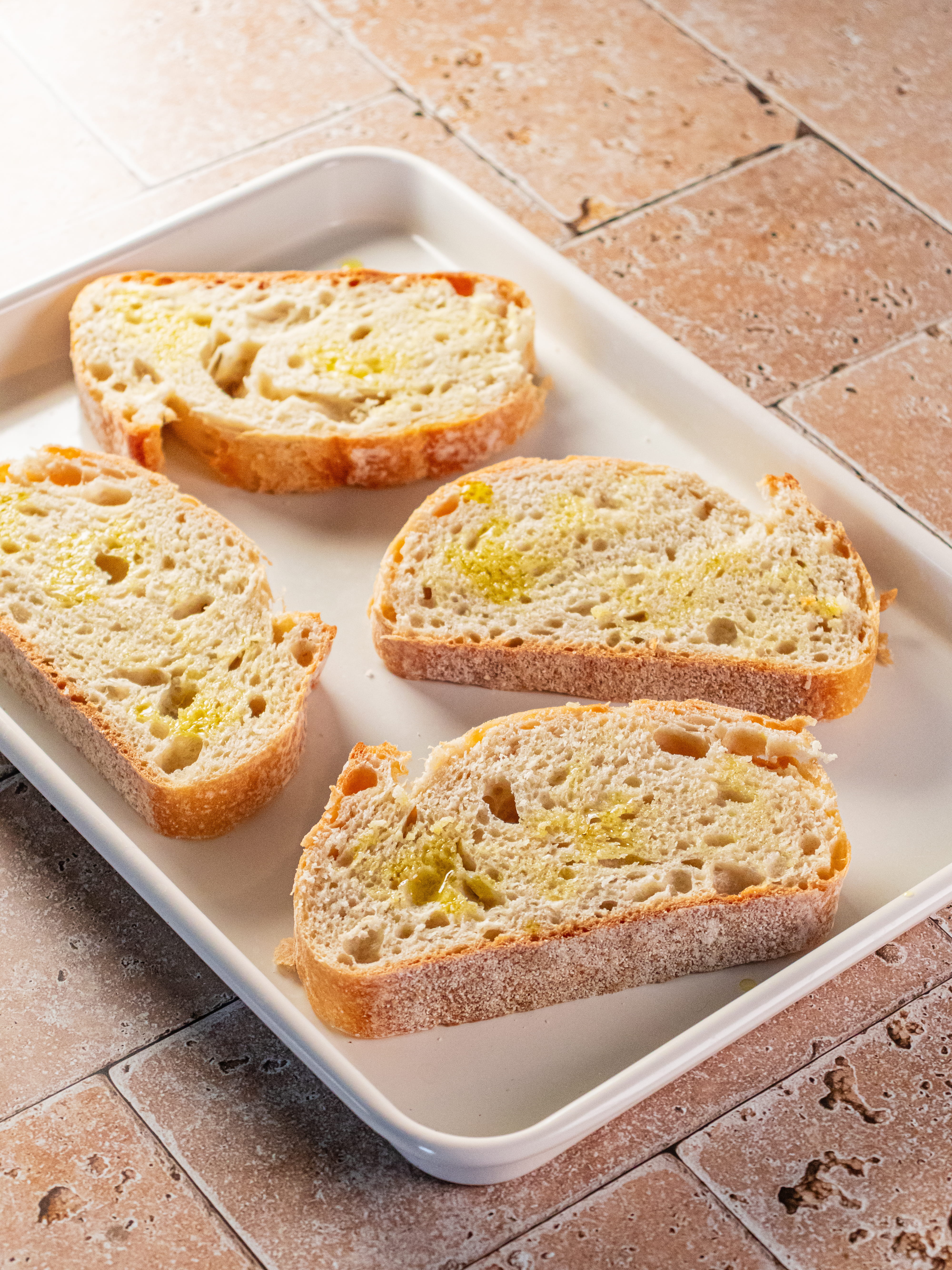 Image of Preheat oven to 375ºF. Place sliced bread on a baking...