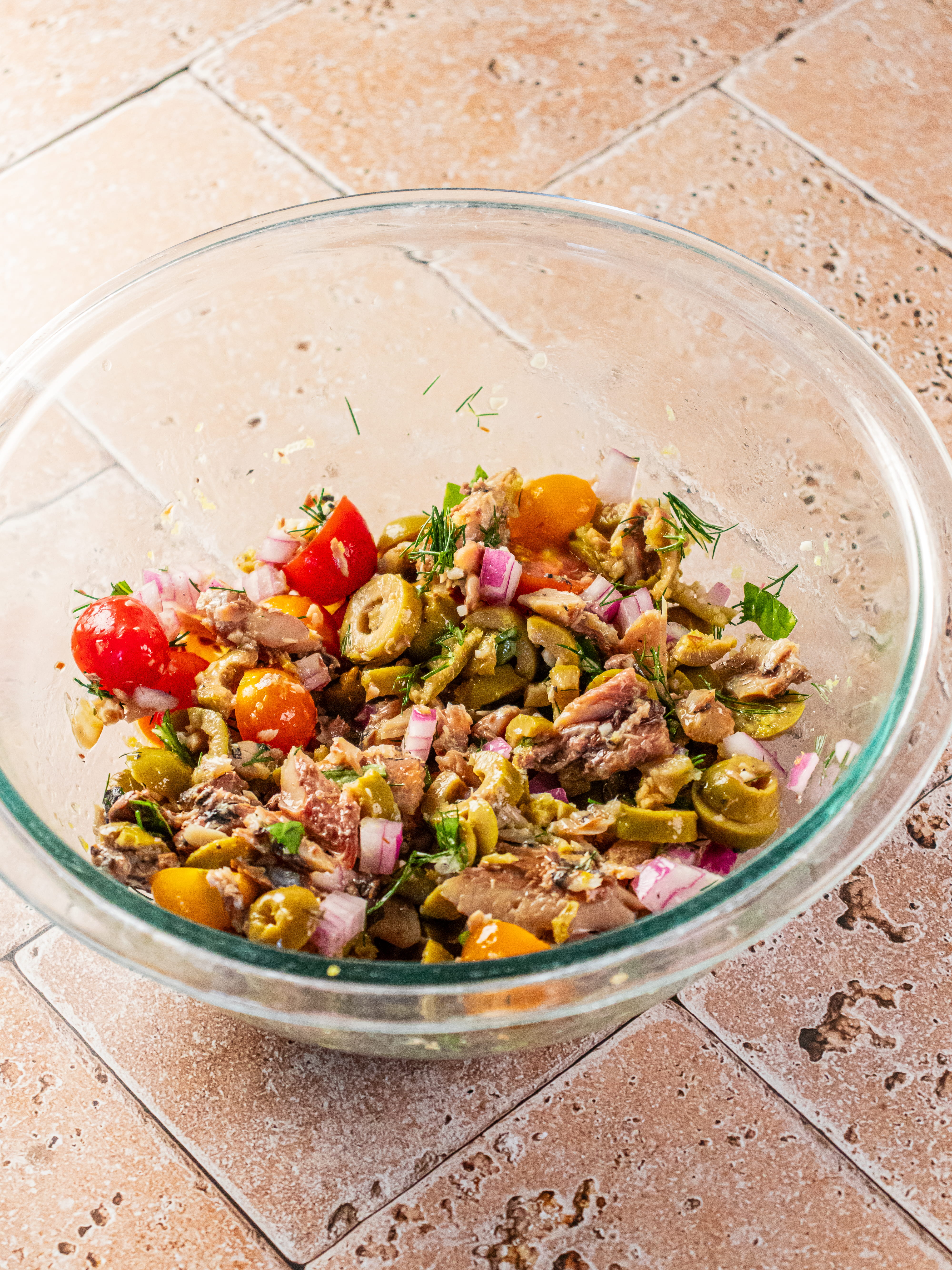 Image of Drain sauce from sardines and place sardines in a bowl....