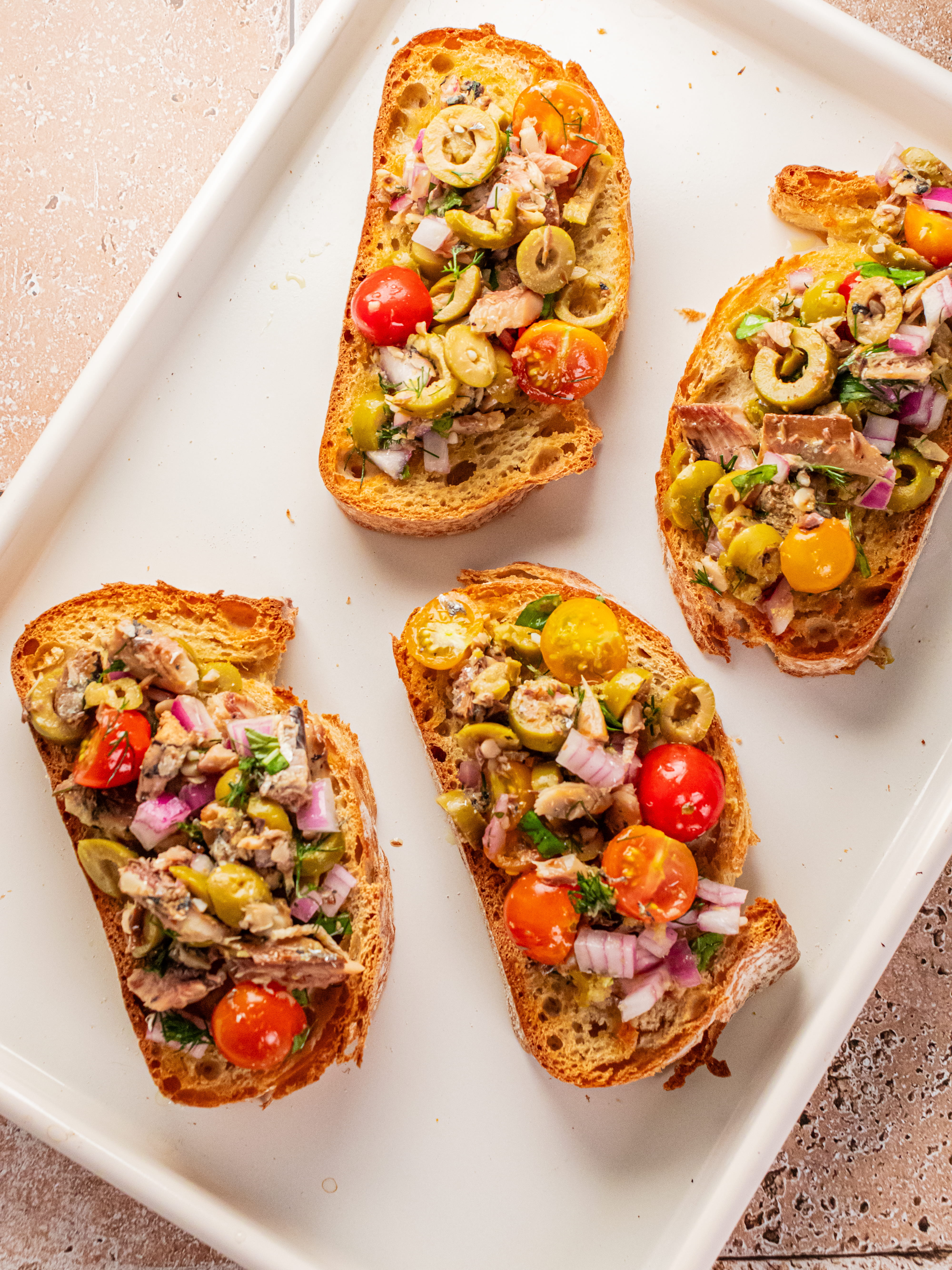 Image of Spoon sardine salad on toasted bread and serve right away.