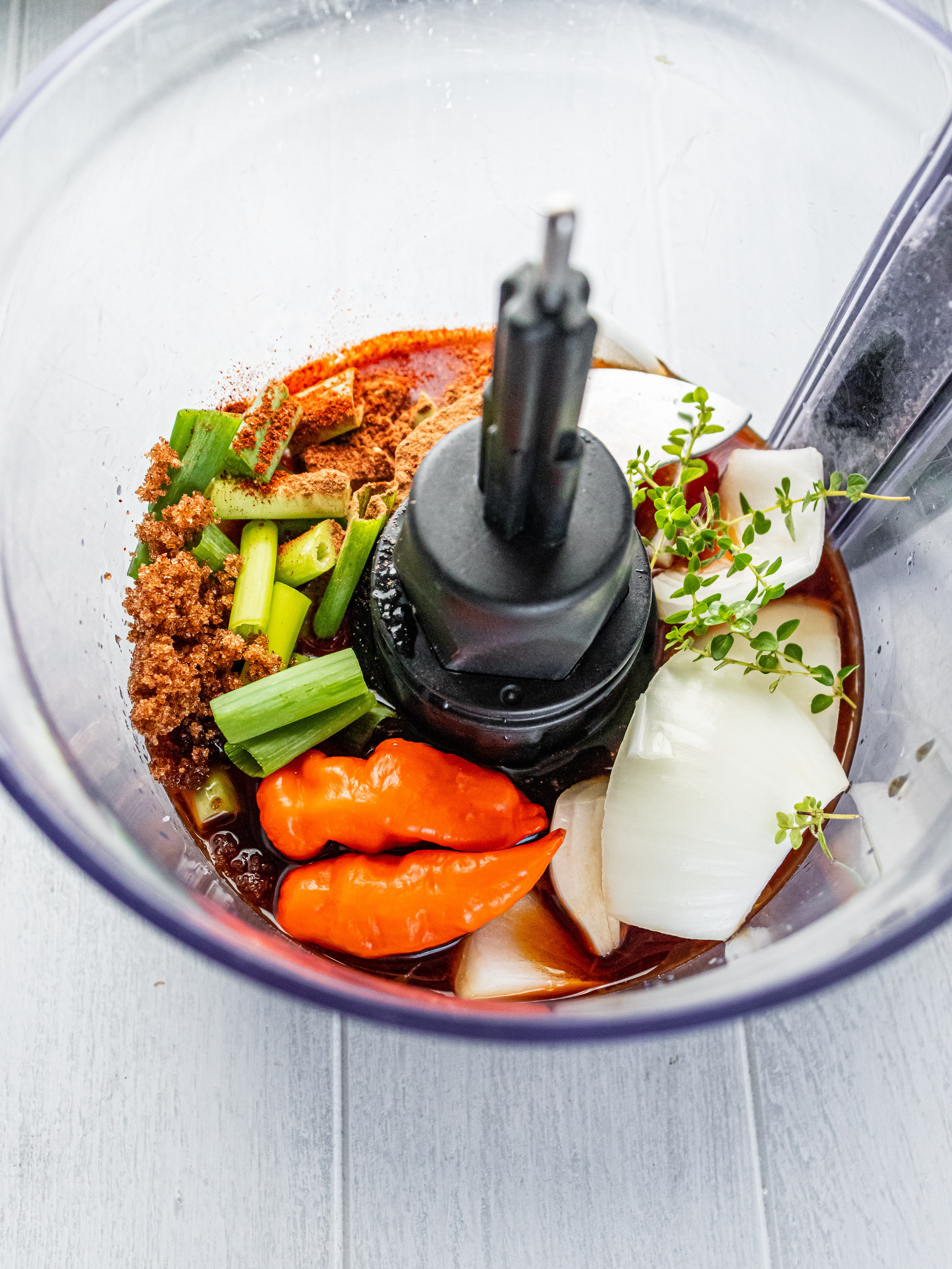 Image of Remove stems from peppers and add all ingredients to a...