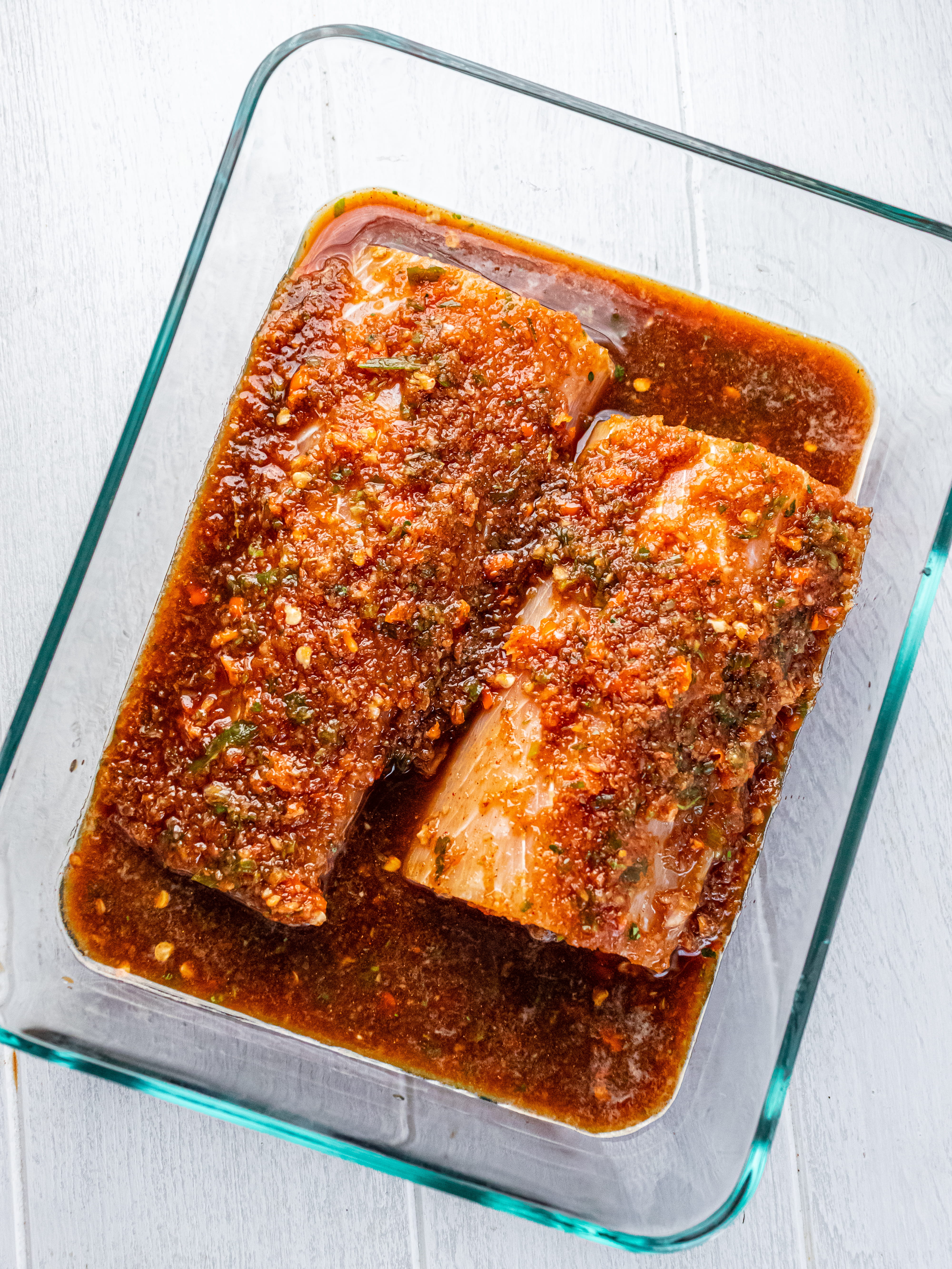 Image of Add fish to a shallow glass dish and cover with...