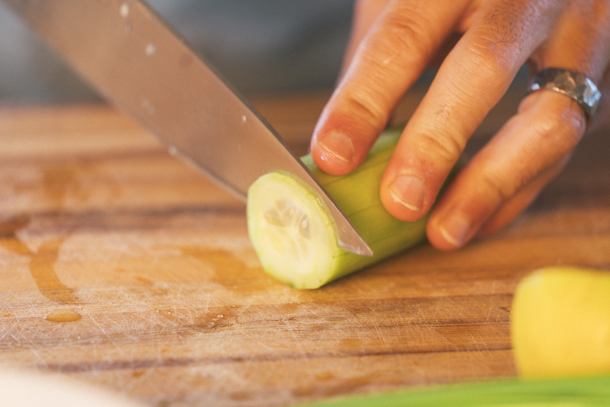 Image of Place cucumber, daikon, and red onion in a small bowl....
