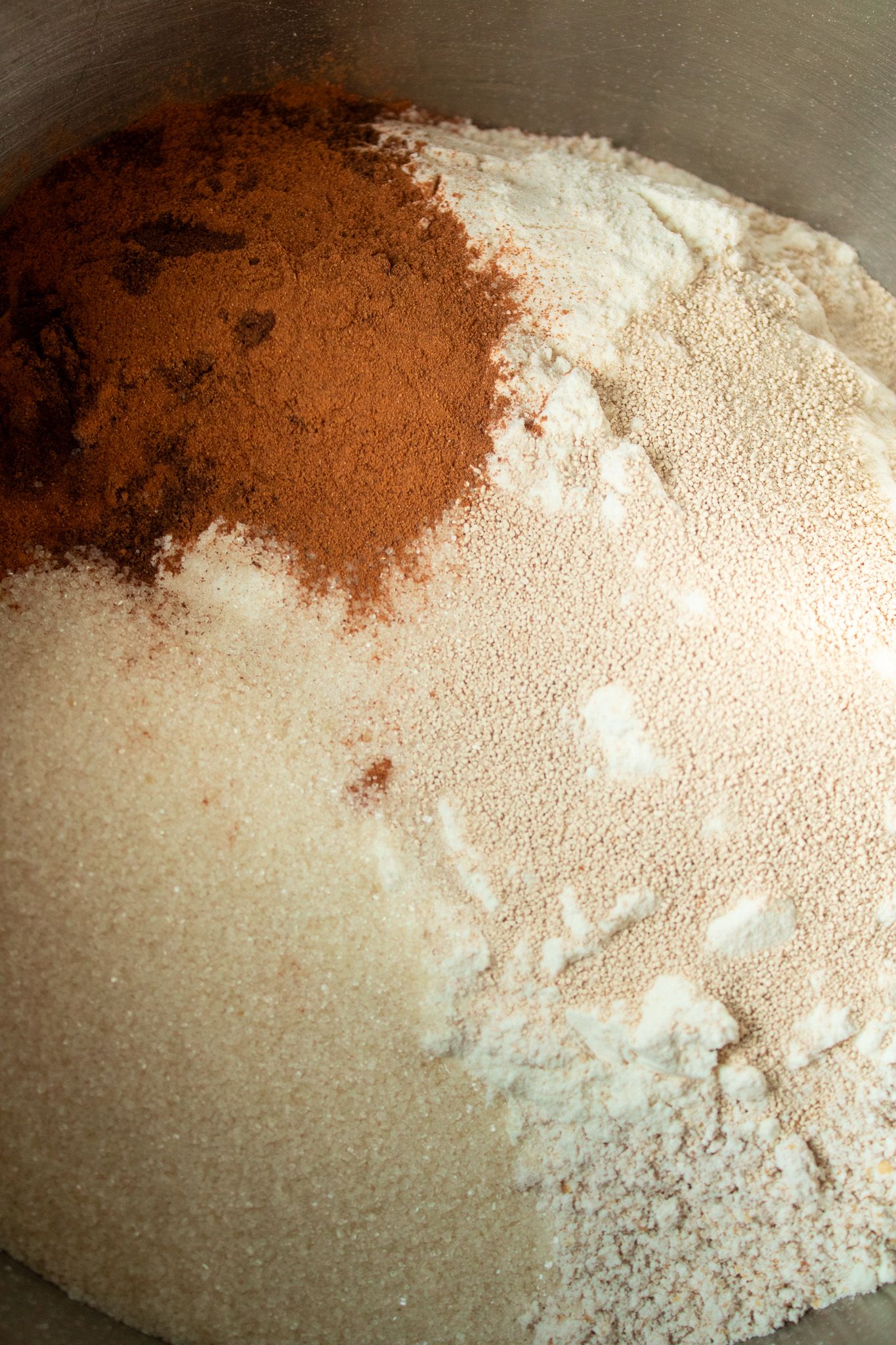 Image of Mix together the dry ingredients. Flours, yeast, sugar, spices and...