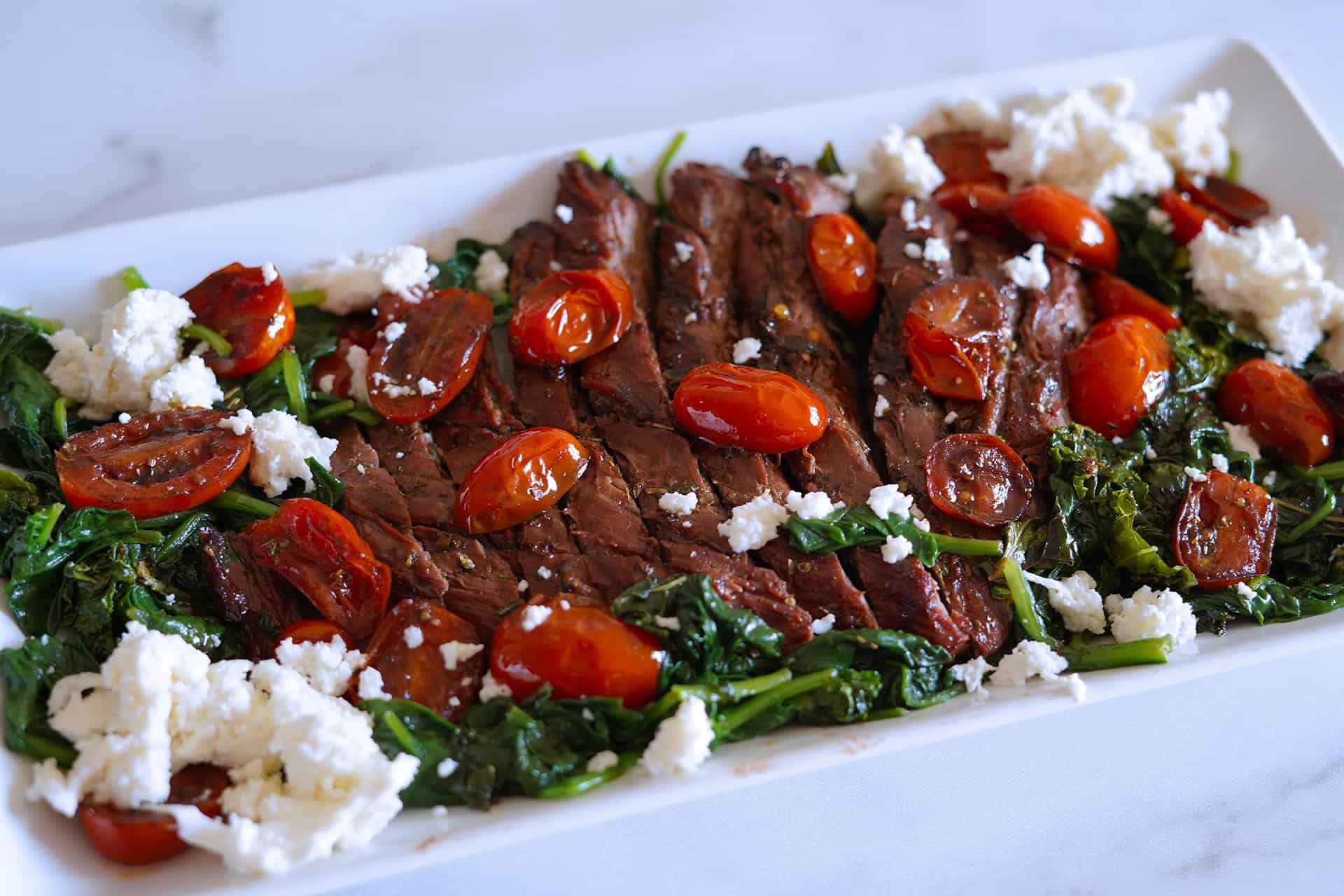 Balsamic Marinated Flank Steak with Sautéed Tomatoes & Spinach Recipe