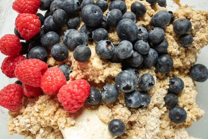 Image of Gently add in berries or mixings of your liking.