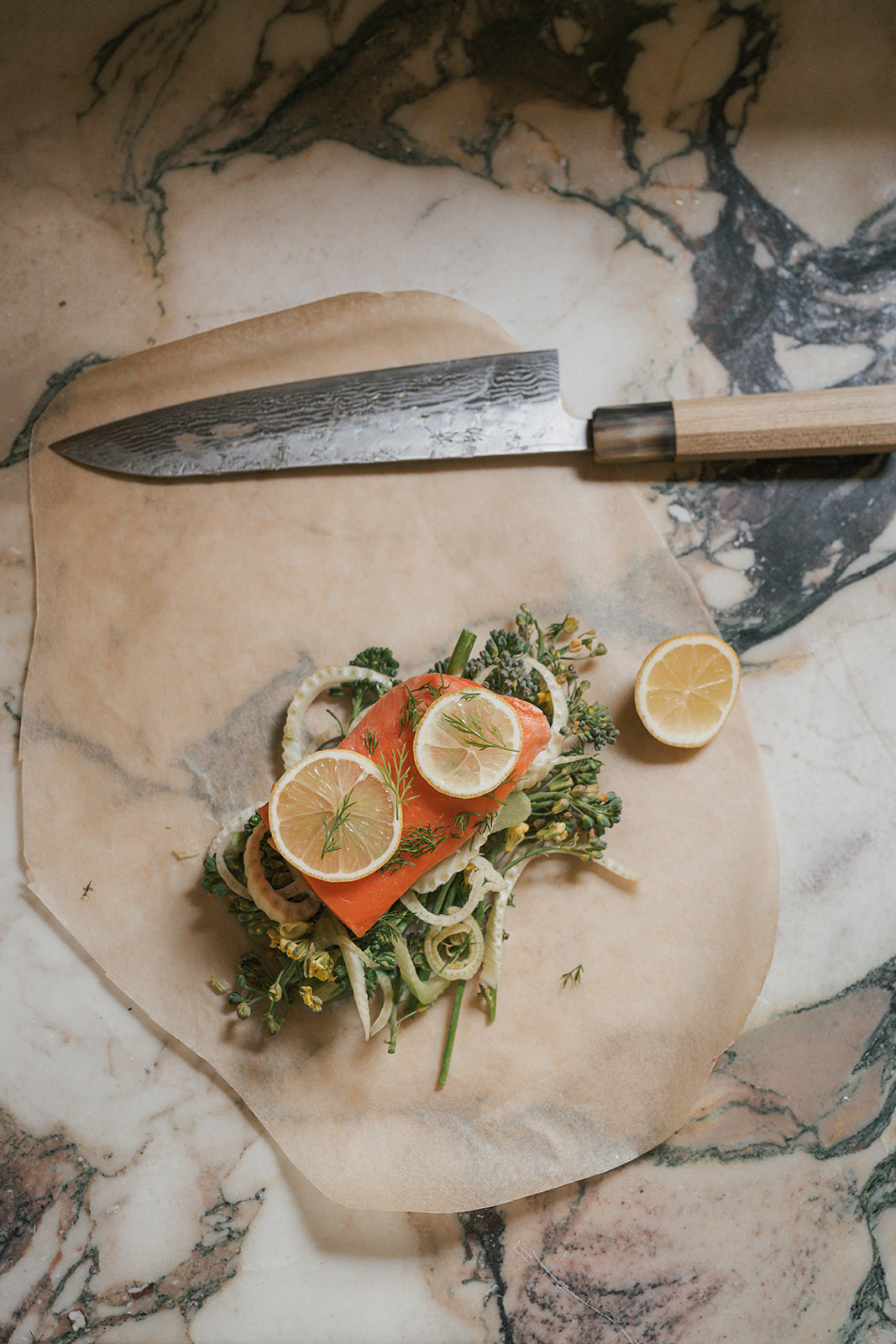 Image of Top and seal: Lay 2–3 lemon slices over each fillet...