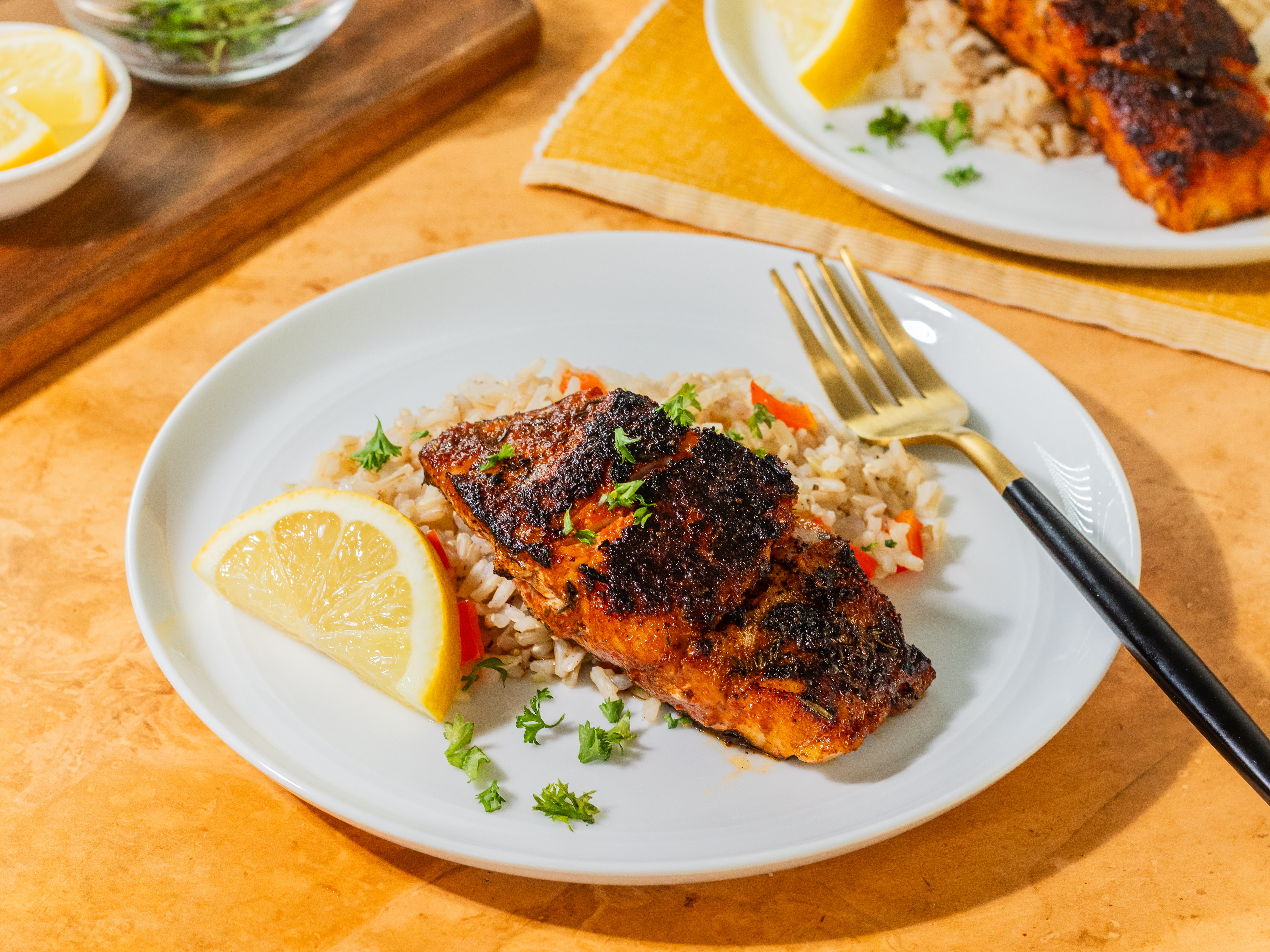Image of Serve hot with lemon slices and garnish with parsley.