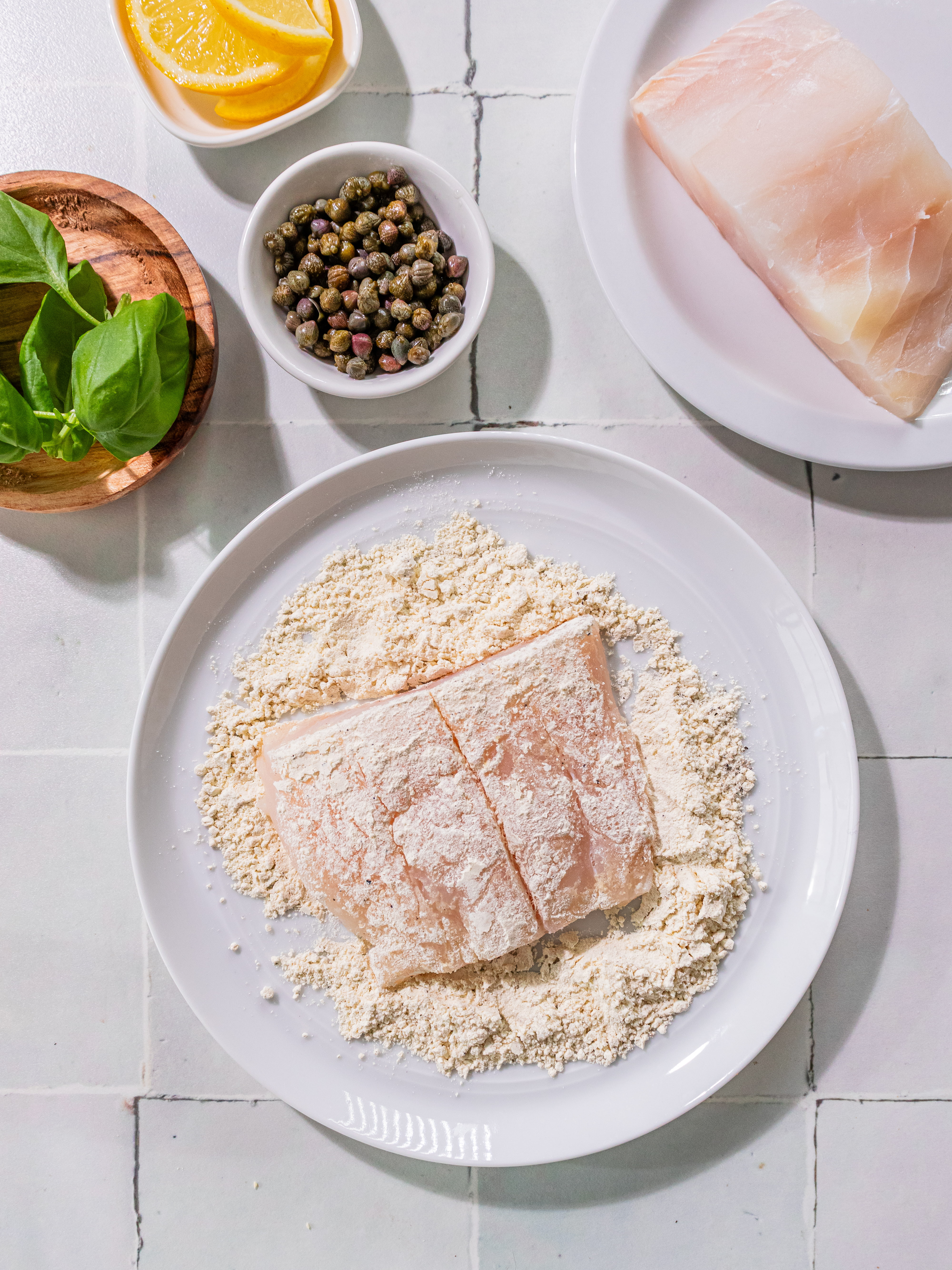 Image of Blot fish with paper towels. Stir together flour, salt, and...