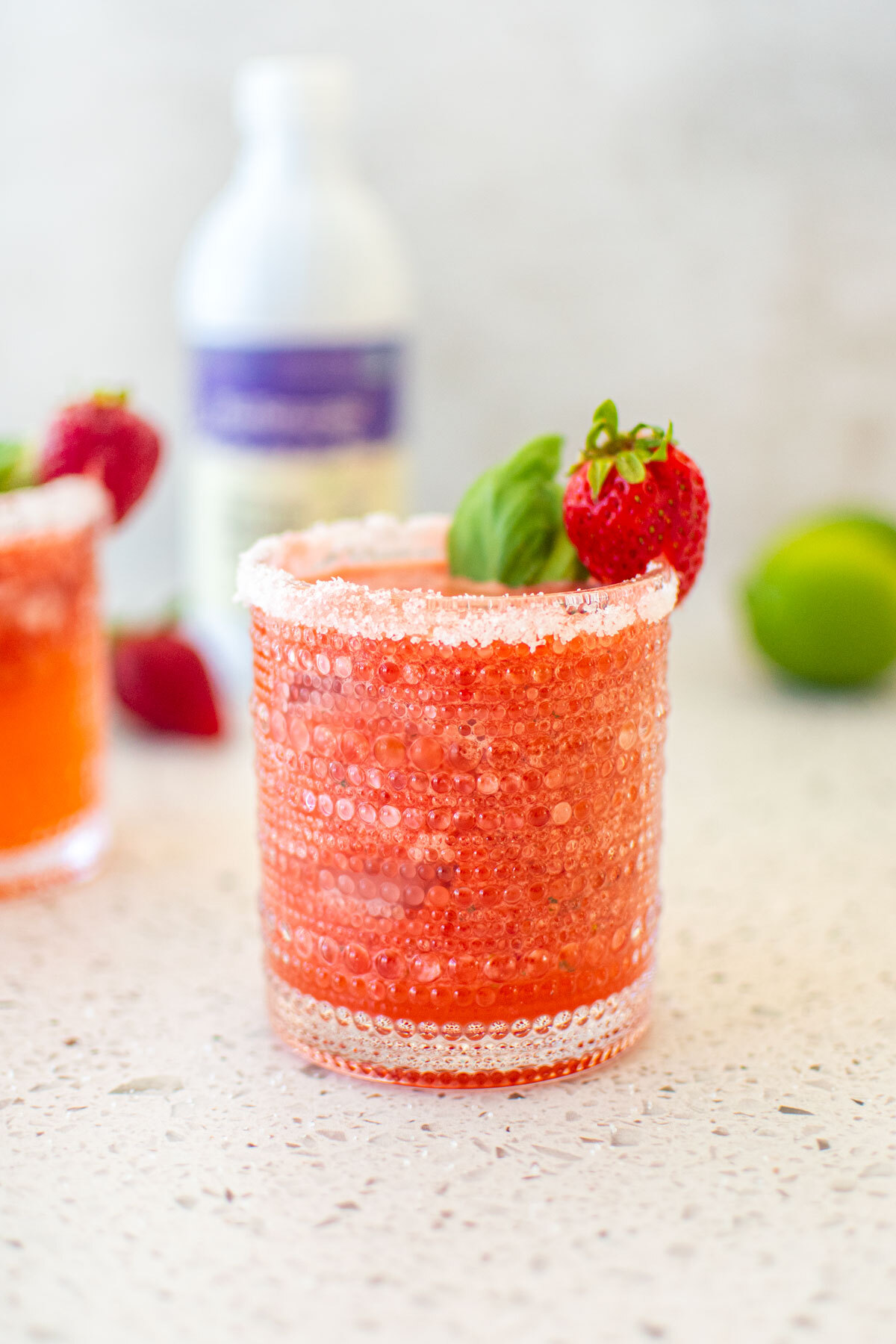 Image of Garnish with a fresh strawberry and/or lime wedge