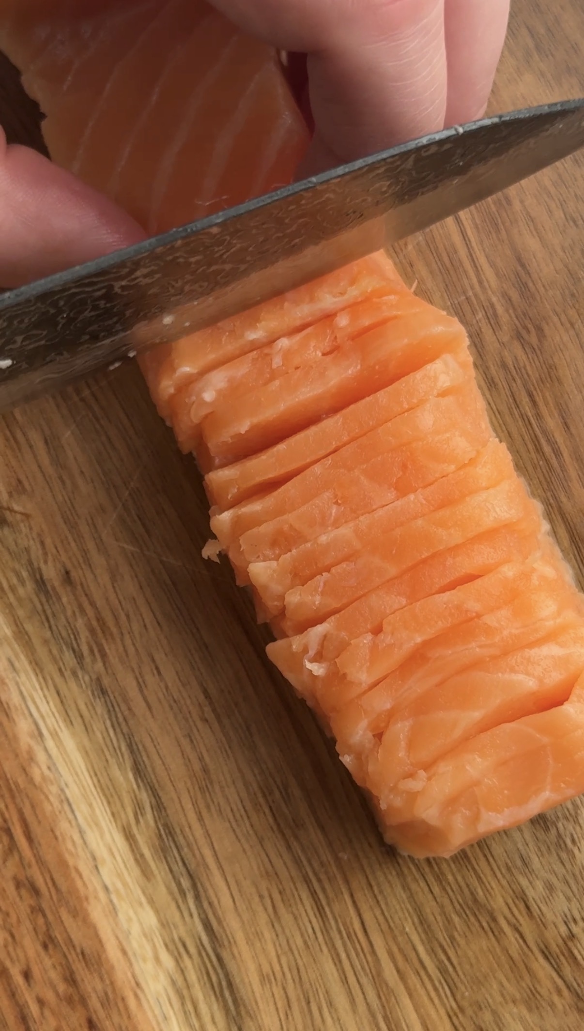 Image of Slice the fish as thin as you can horizontally across...