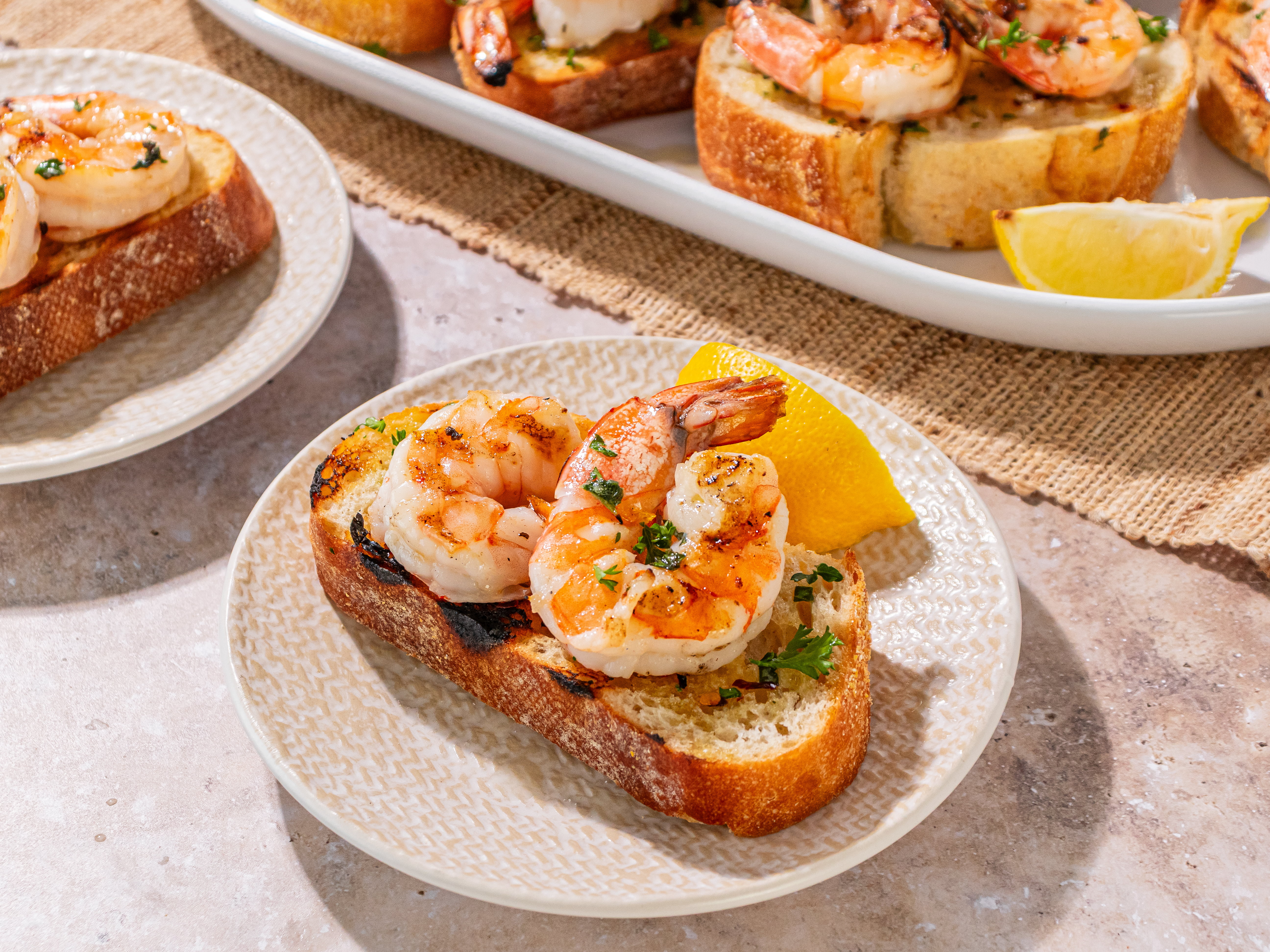 Image of Serve shrimp over grilled bread drizzled with olive oil and...
