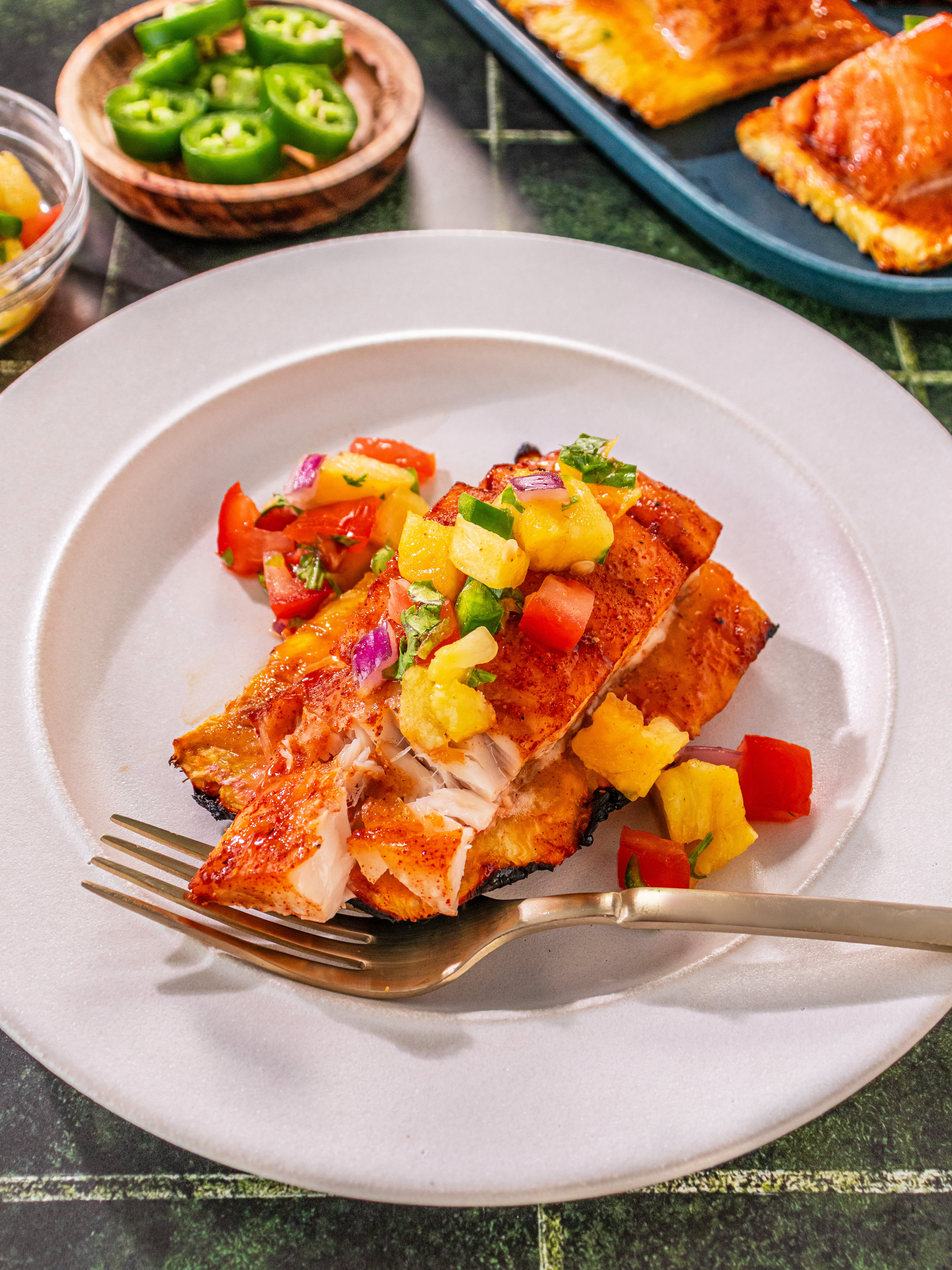 Image of Serve topped with pineapple salsa.