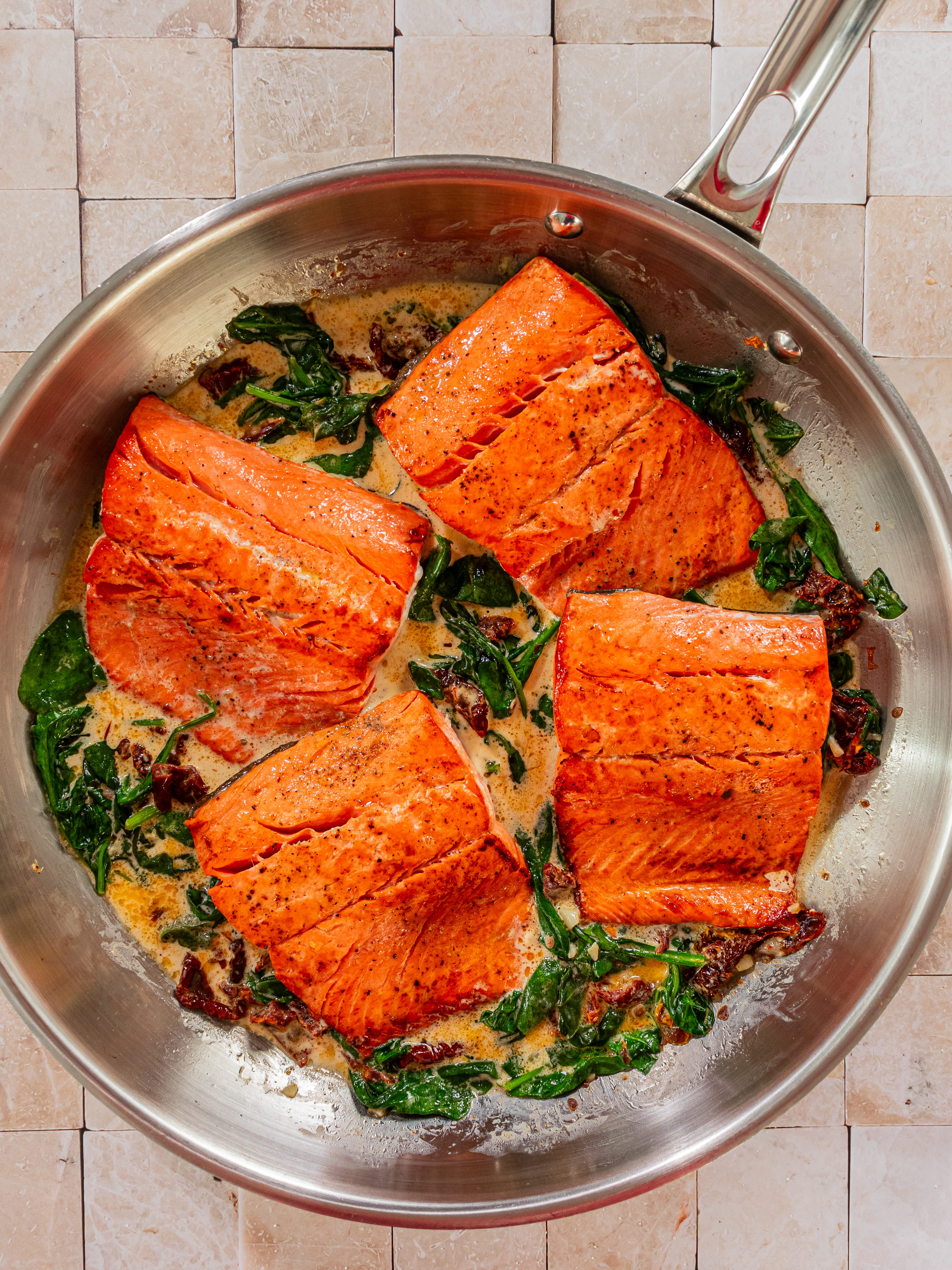 Image of Add chicken stock to skillet followed by heavy cream and...