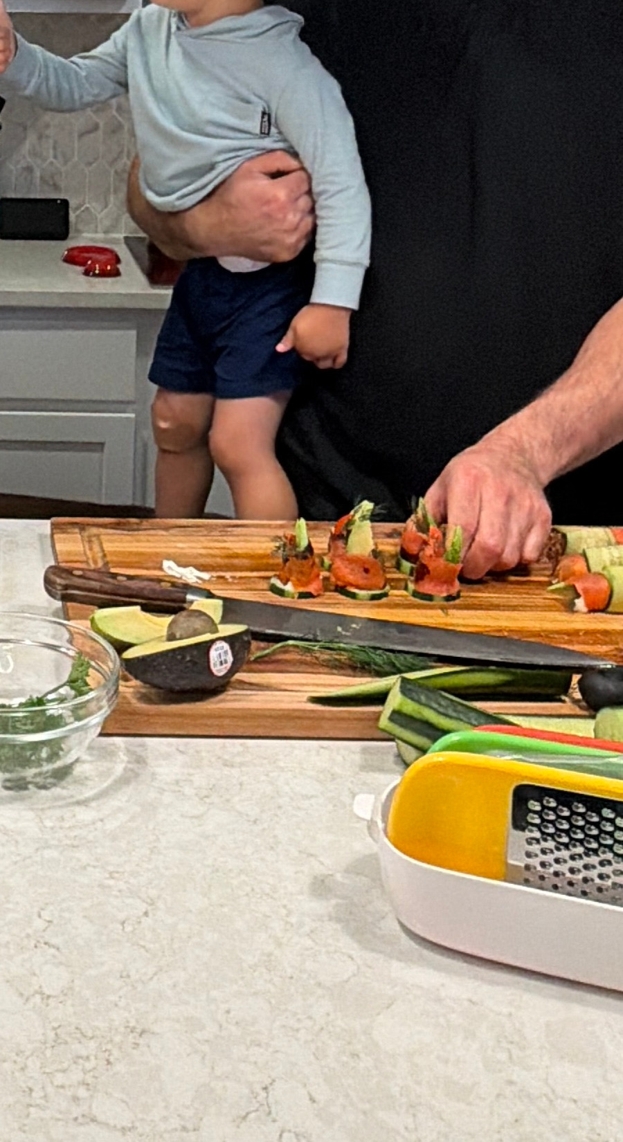 Image of Starting from the filled end, tightly roll the cucumber into...