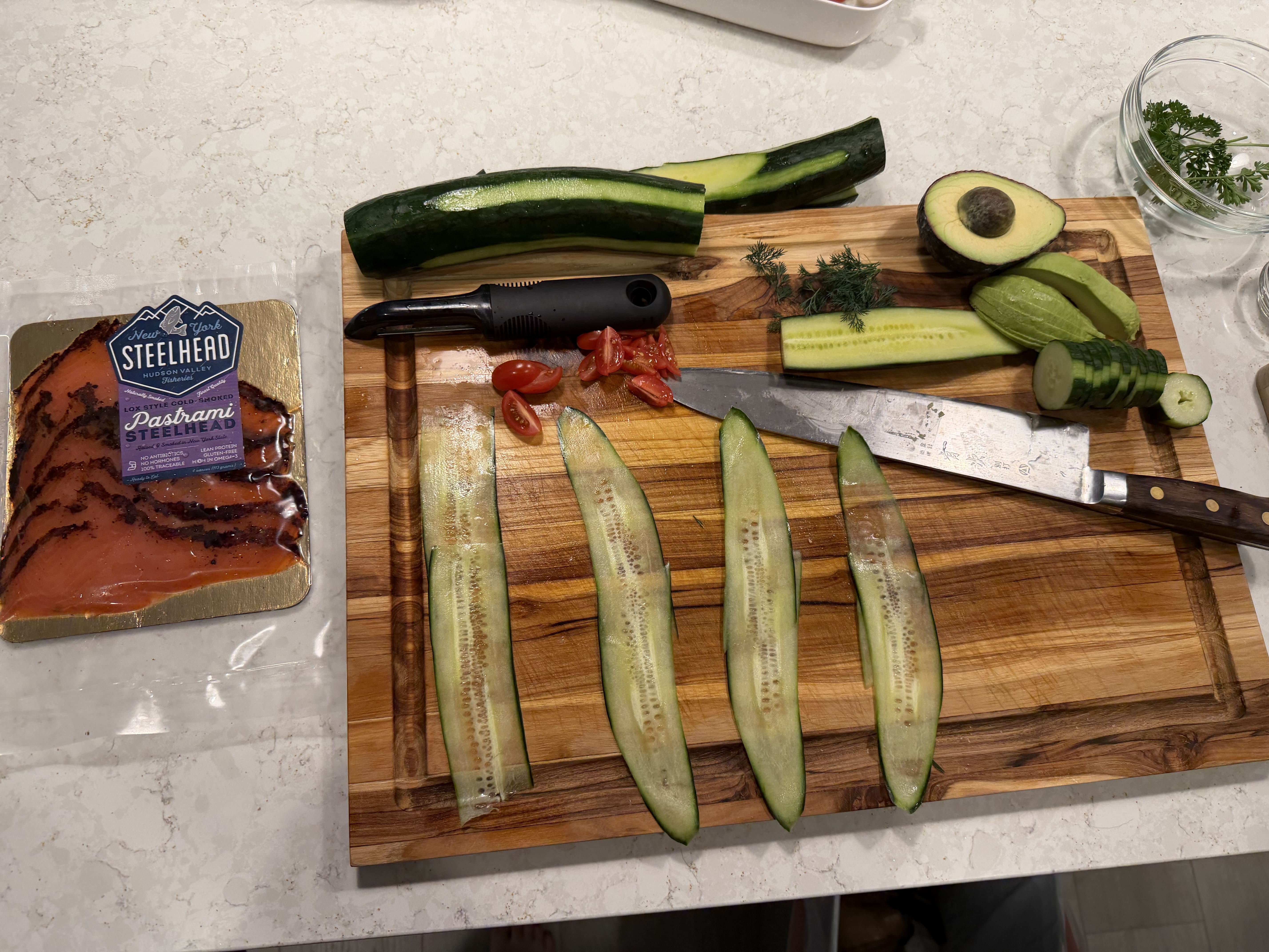 Image of Lay 2–3 cucumber strips overlapping in a staggered (stepped) pattern...