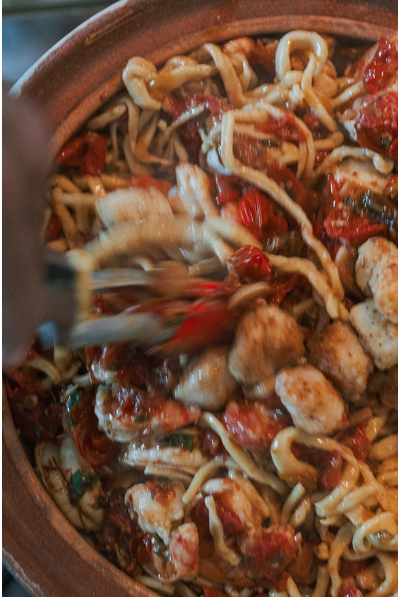 Image of Toss the seafood mixture with the cooked pasta.