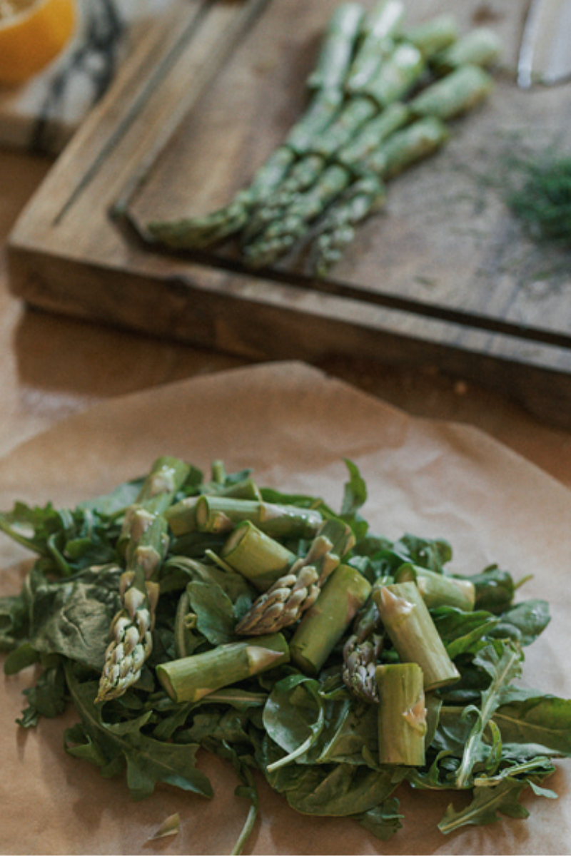 Image of Top each with a portion of asparagus.