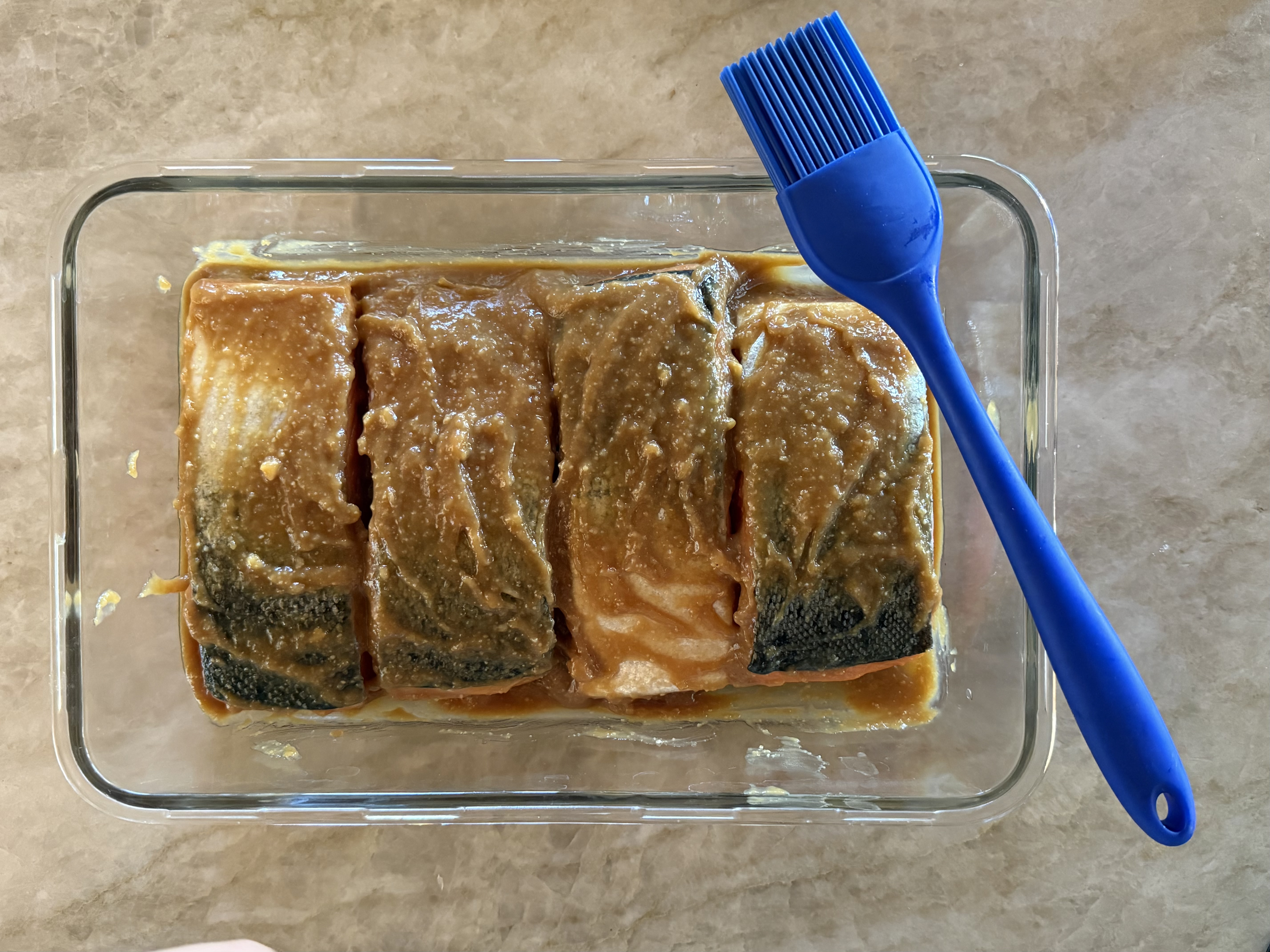 Image of Once the marinade has cooled, place the salmon fillets into...