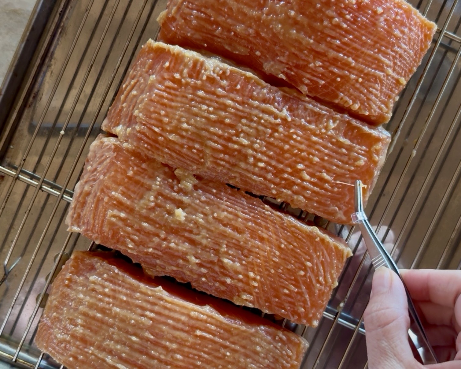 Image of Remove the salmon from the refrigerator and gently scrape off...