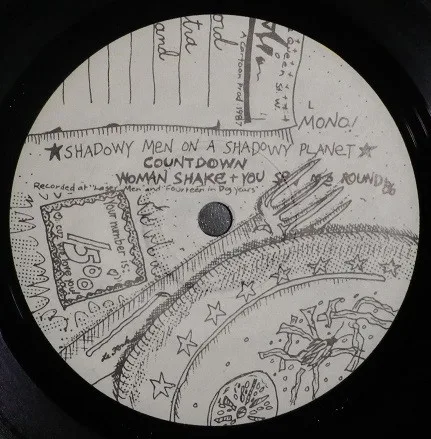 Official album cover art for the release Live Record With Extra Bread And Cheese by Shadowy Men on a Shadowy Planet