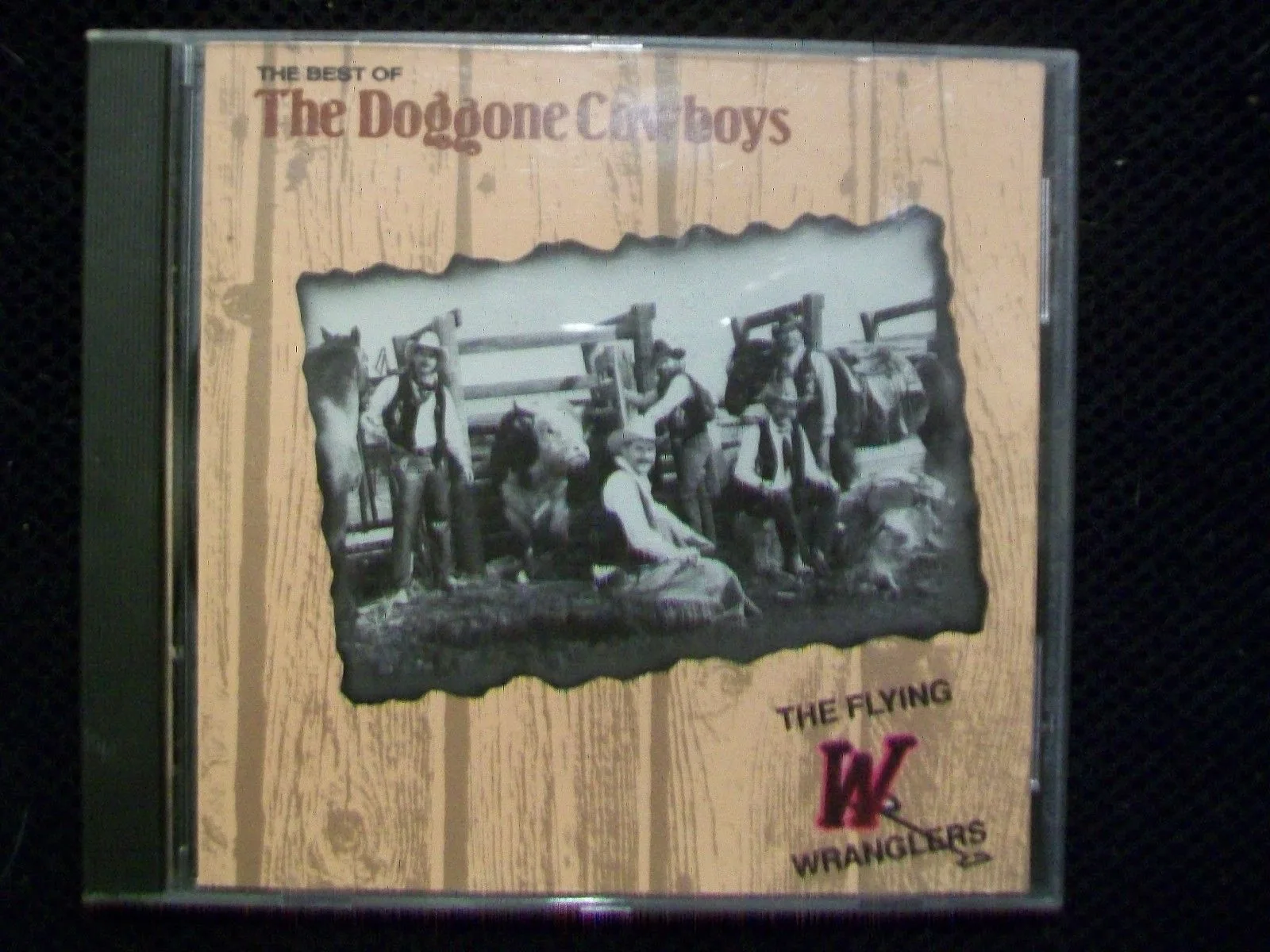 Official album cover art for the release The Best of The Doggone Cowboys by The Flying W Wranglers