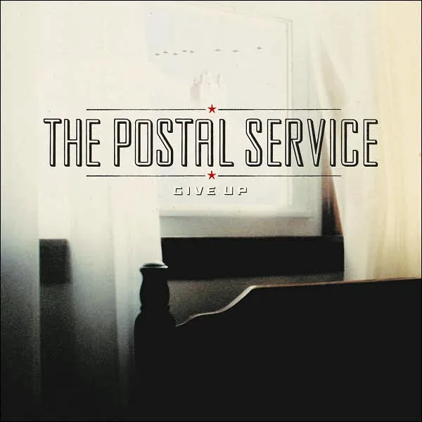 Official album cover art for the release Give Up by The Postal Service