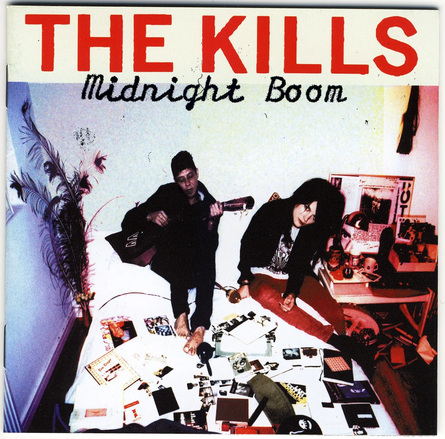 Official album cover art for the release Midnight Boom by The Kills