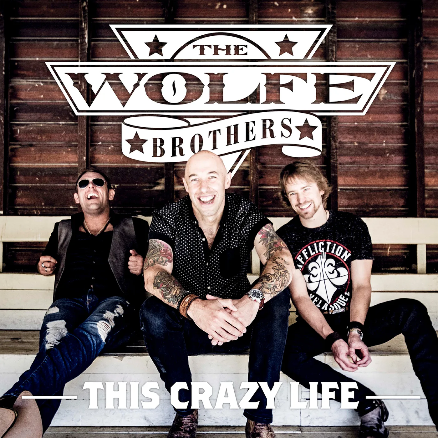 Official album cover art for the release This Crazy Life by The Wolfe Brothers