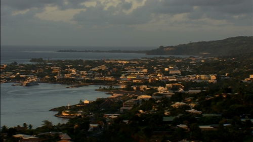 Aerial shot of town and port of Papeete by the sunset, on Island of Tahiti in french Polynesia