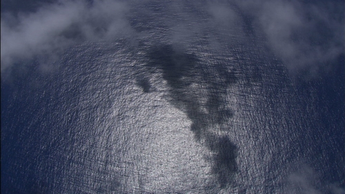 Vertical Aerial shot of the south Pacific ocean and clouds, in french Polynesia