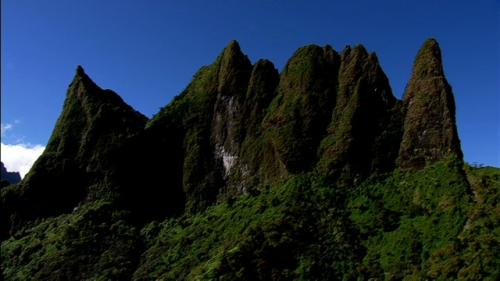 Cinematic aerial shot of th Diadème or Mount Diadème of Tahiti, in french Polynesia, camera mouvement up, Te Hena o Mai’ao