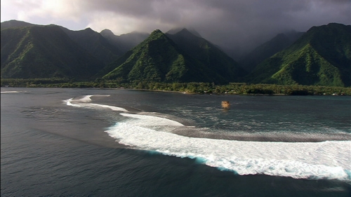 Aerial shot of the pass Teahupo and mountains, Tahiti,  in French Polynesia,