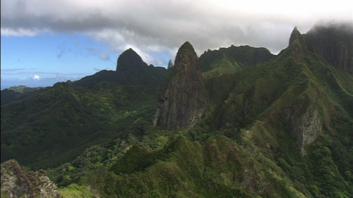 Aerial shot of the top of mountains of island ua Pou in Marquesas archipelago, Polynesia