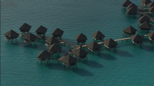 Bora Bora, aerial shot of over water bungalows of luxurious hotel, Lagoon, french Polynesia