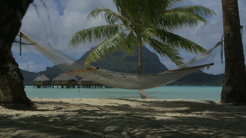 Bora Bora, Hamac on the white sand beach, under the palm trees