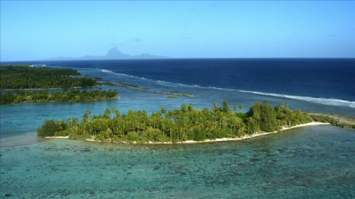 4K UHD, Tahaa, Barrier Reef and small ilots along the ocean, Aerial, Bora Bora island in the background