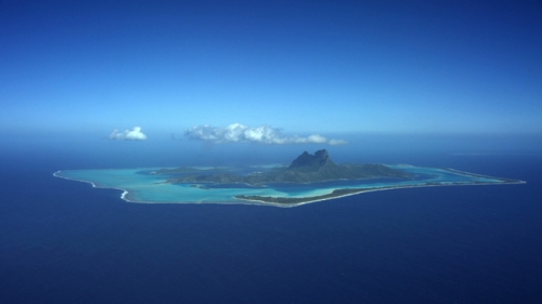4K UHD, Bora Bora, Aerial shot of the island and lagoon from ocean