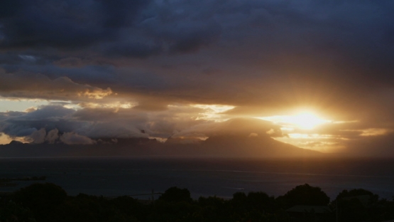 Moorea, cloudy sunset on the island, shot from Tahiti