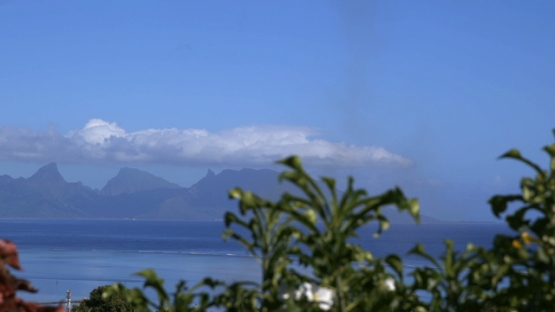 Moorea, panoramic view of the island during the sunny morning, shot from Tahiti