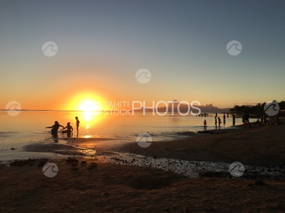 Moorea during sunset, kids playing, seen from the beach at Le Meridien, Punaauia