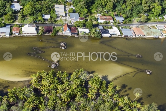 Huahine, aerial view of fisher house in the river